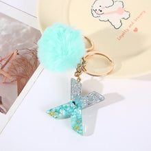 Letter Key Pendant With Green Fluffy Pompom