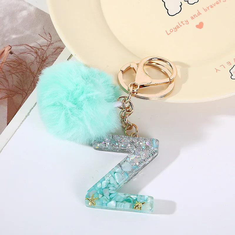 Letter Key Pendant With Green Fluffy Pompom
